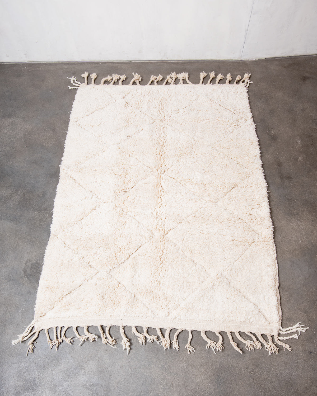 Modern, designer, handcrafted Berber rug from Morocco. Beniourain carpet with minimalist design, natural wool pile and a fluffy texture.